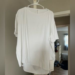 Lululemon back in action nulu white tee shirt size 16 new with tags